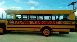 Yellow School Bus in Cuba graffitied with "U.S-Cuba Friendshipment"