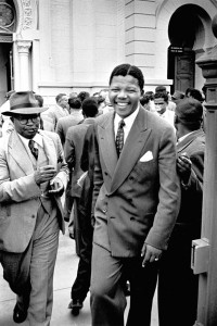 A young Nelson Mandela leaves Pretoria Courthouse following the dismissal of the state's case against him in the so-called Treason Trial.