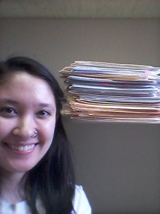 The stack of the essays I worked on during the project, with my face for scale