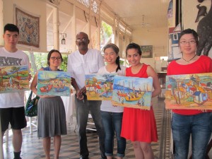 Students with George Desarmes and his paintings