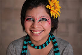 Inocente expresses herself through her art not only on a canvas, but on her face as well
