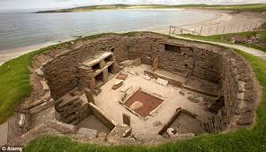 Excavation of a Skara Brae home, complete with artifacts and features such as furniture and drains.