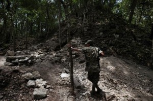 Guatemalan soldier patrolling the border surrounding the Mayan city  Xultun