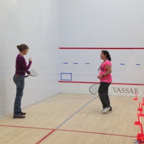 Natalie plays squash with her mentor, Calais