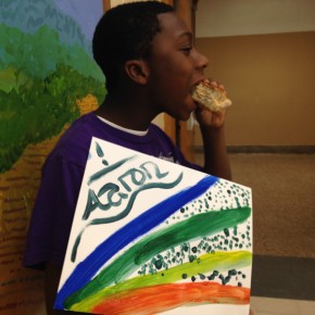 Aaron enjoys a snack after finishing his project
