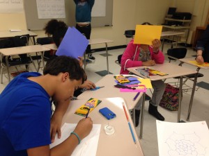 The eighth graders work on their drawings.