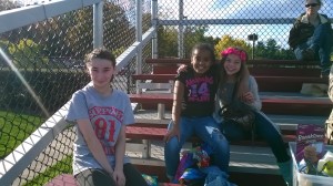 VAST scholars Chiara, Mya, and Gianna have fun in the stands before the game!